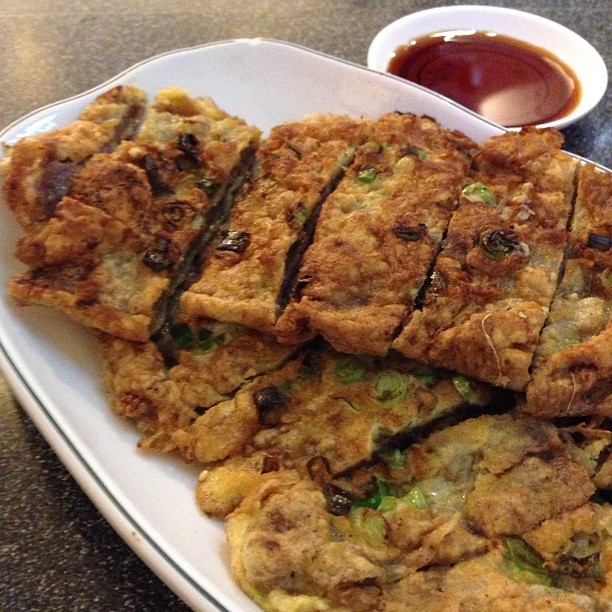 Slices of meat jun with dipping sauce